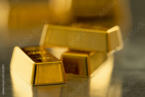 stack of golder bars on metal