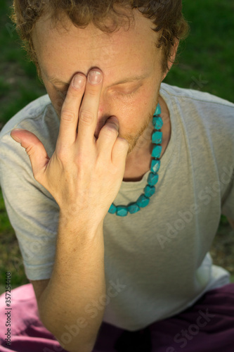 Wallpaper Mural Red-haired male Buddhist meditates on a background of nature  Torontodigital.ca