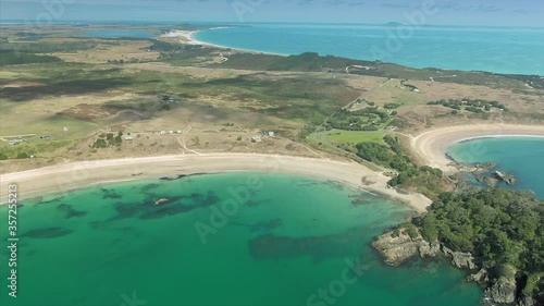 Aerial flying over Maitai Bay on the Karikari Peninsula, Northland, New Zealand photo