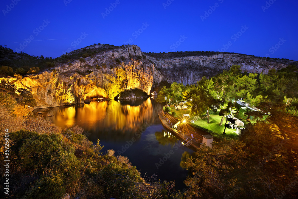 Night view of Vouliagmeni lake, ideal place for relaxation and wellness treatment close to Athens, Attica, Greece.