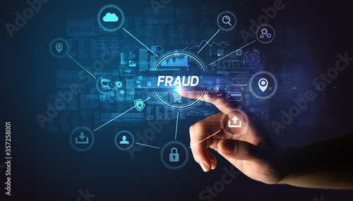 Hand touching FRAUD inscription, Cybersecurity concept