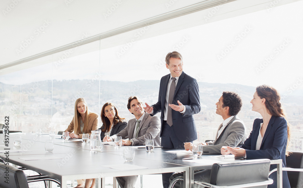 Fototapeta premium Businessman leading meeting in conference room