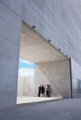 Business people meeting outside modern building