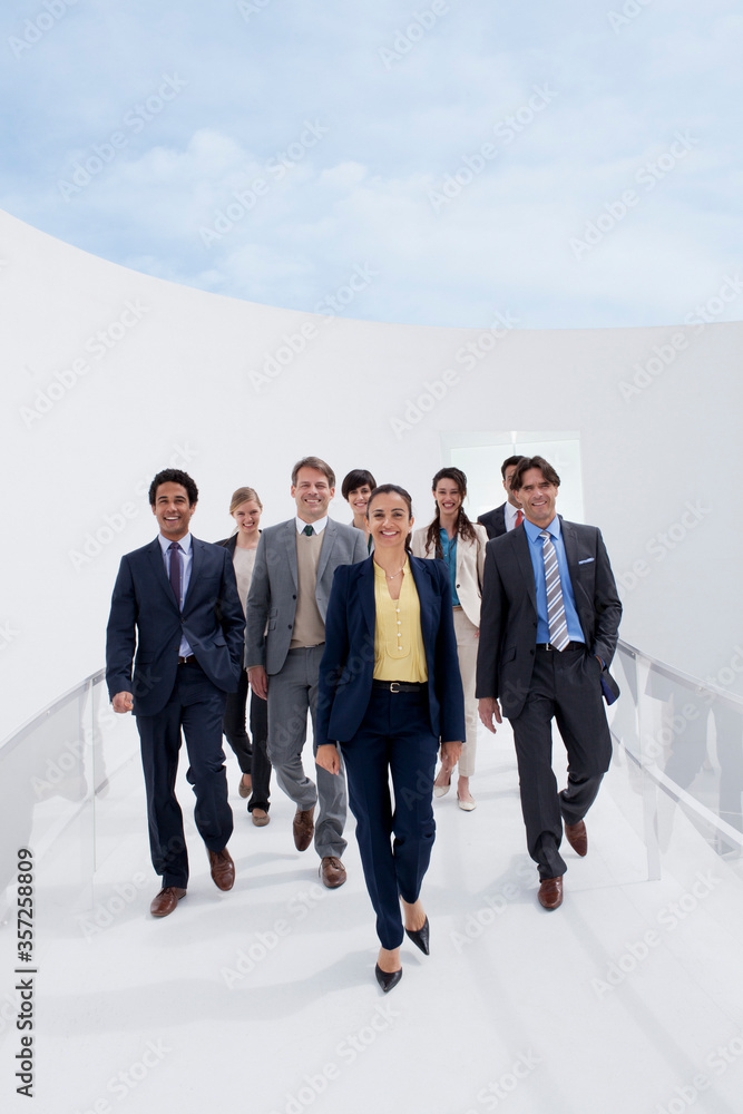 Portrait of smiling business people on walkway Portrait of smiling business people on walkway