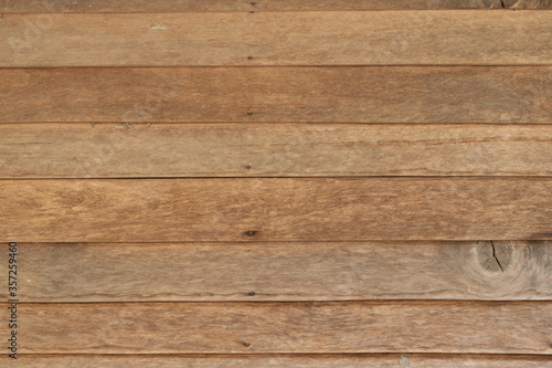 Close-up horizontal stripes of wood plank brown texture background