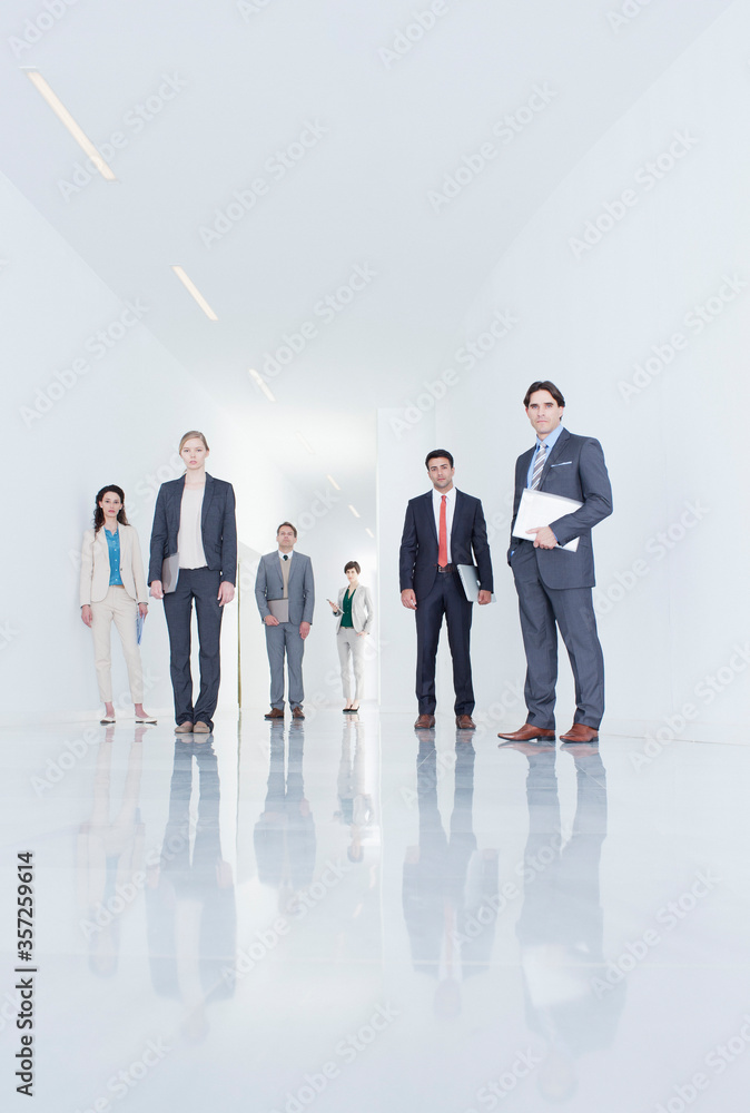 Portrait of confident business people in corridor Portrait of confident business people in corridor