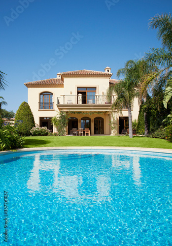 Luxury swimming pool and Spanish villa photo