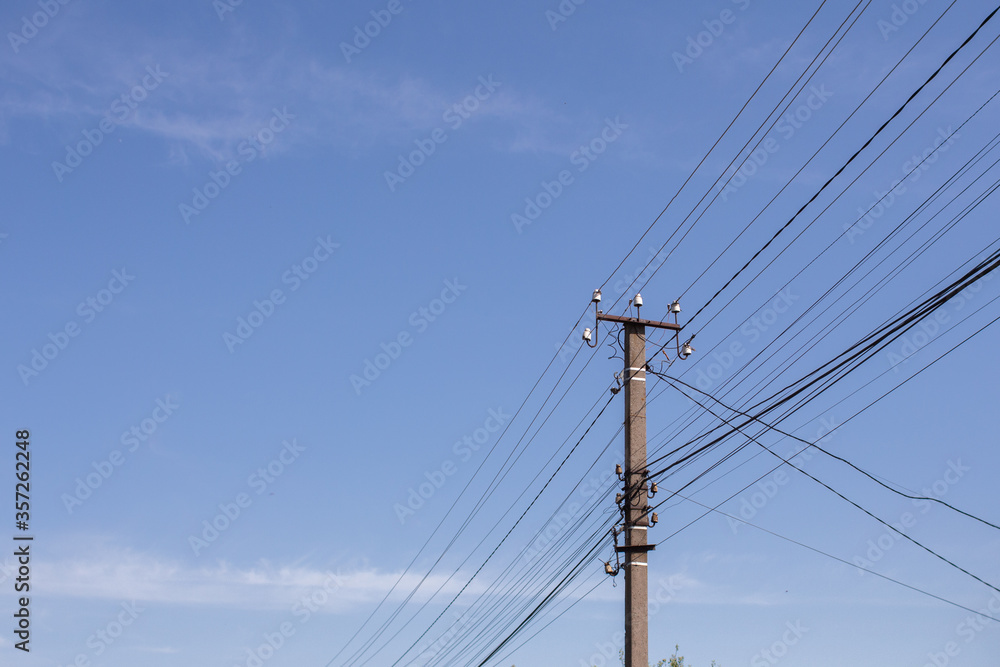 electric wires on a pillar in a city electric wires on a pillar in a city