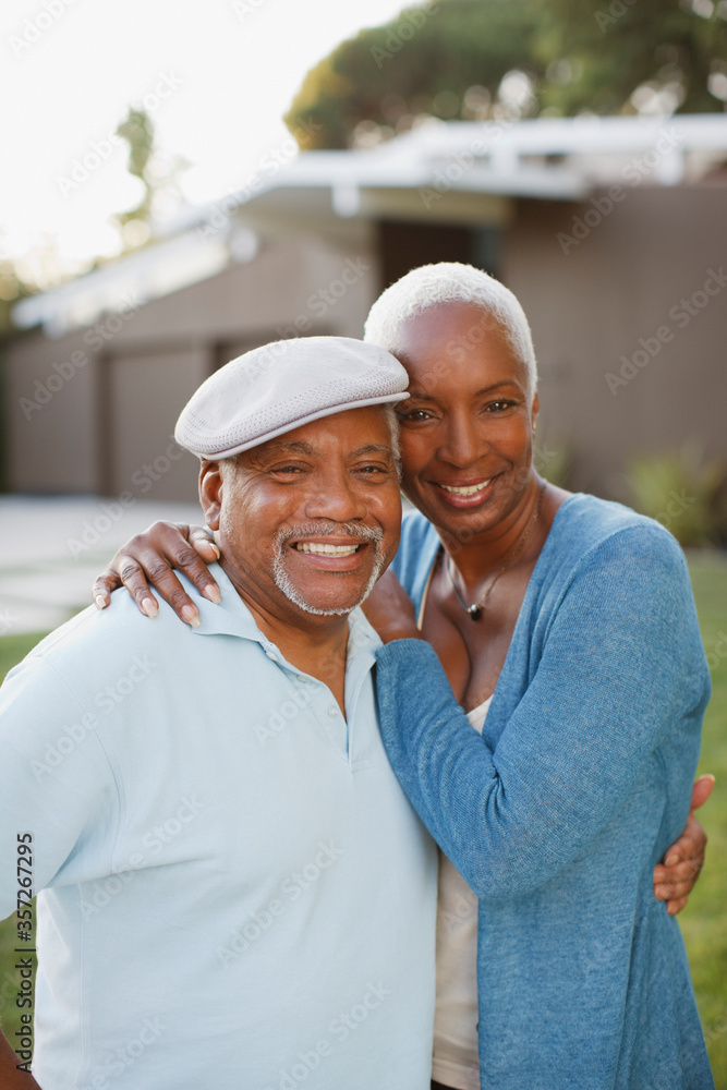 Older couple smiling together outdoors