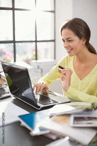 Woman shopping on laptop