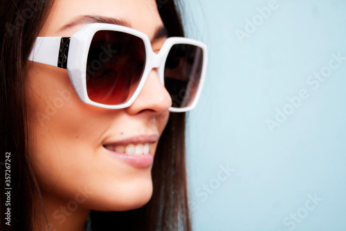 The girl in the sunglasses. Photo of a woman in dark white-rimmed sunglasses.