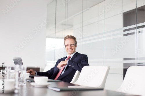 Businessman sitting at meeting table