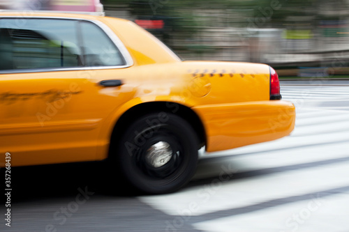 Blurred view of taxi on city street