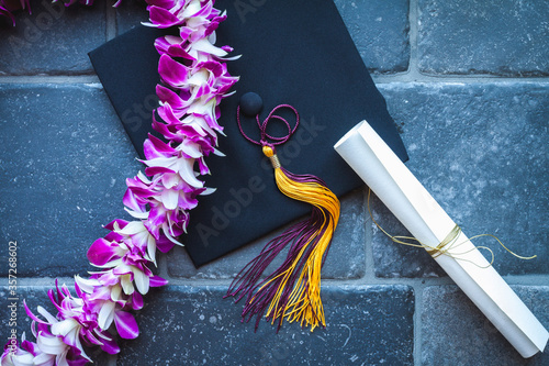 Graduation with mortar, lei and diploma