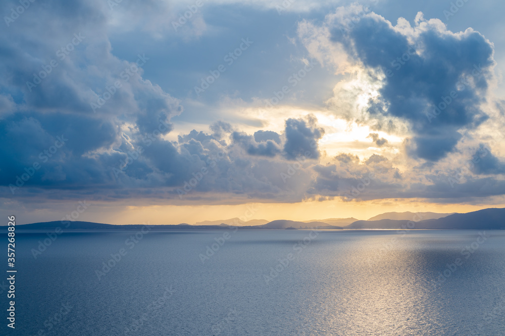 Landscape of the Mediterranean Sea and the coast at sunset from the Mirador de sa Torre, on a cloudy day. On the island of Mallorca.