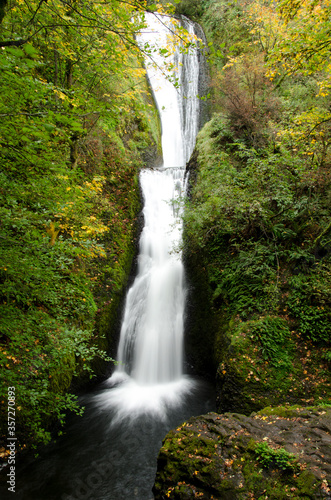 Fototapeta Naklejka Na Ścianę i Meble -  Waterfall rushing over rocky hillside