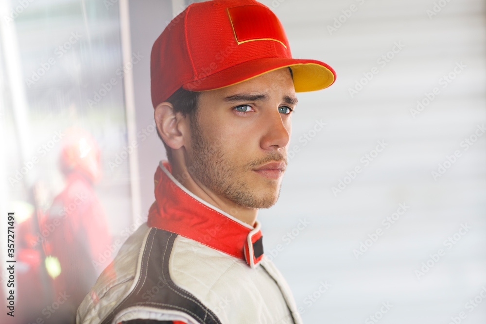 Racer standing in garage