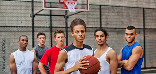 Men standing on basketball court