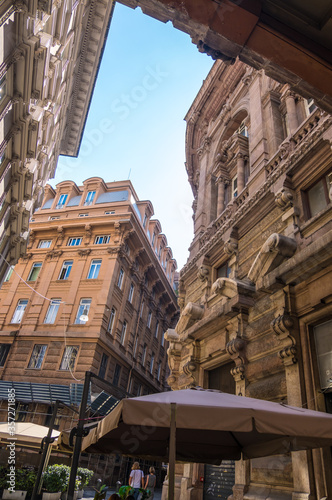 Genoa, Italy - August 18, 2019: Via XX Setembre, the main boulevard in Genoa with its arcades, beautiful buildings and a wide variety of modern shops © kateafter