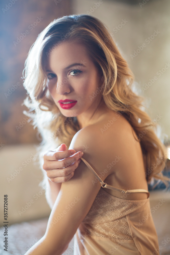 Naklejka premium Woman wearing lingerie in bedroom