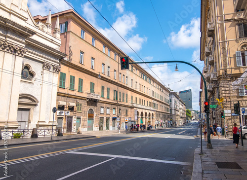 Genoa, Italy - August 18, 2019: Via XX Setembre, the main boulevard in Genoa with its arcades, beautiful buildings and a wide variety of modern shops