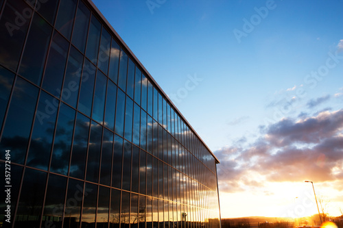 Sunrise sky reflected in modern building windows