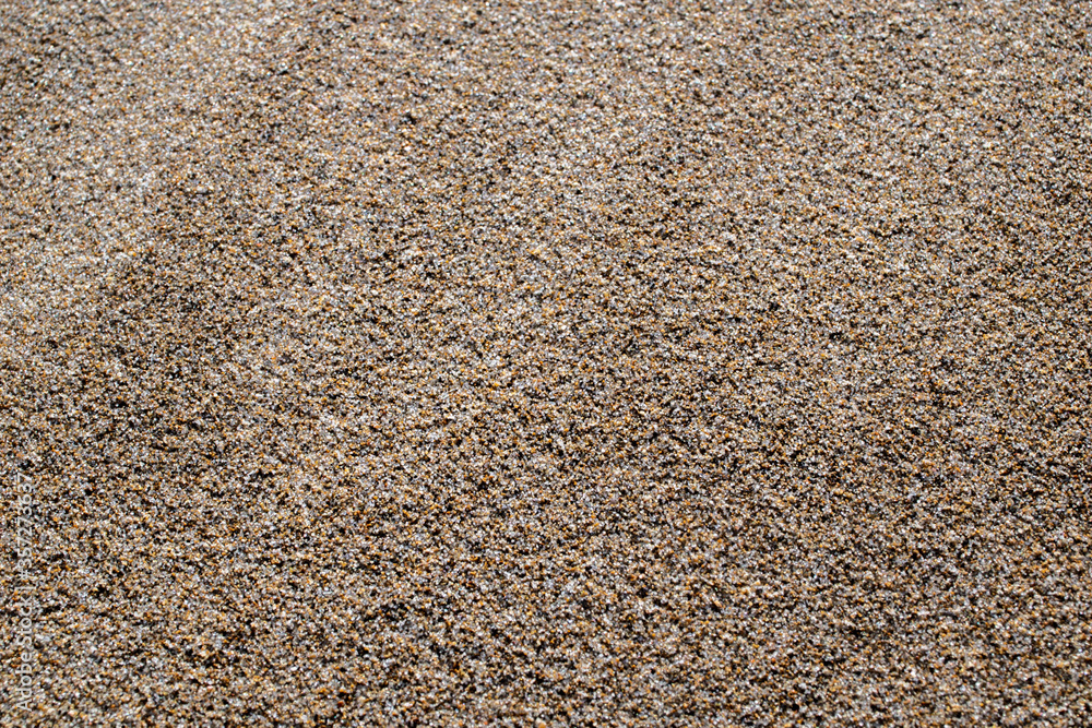 Sand texture and background.Sand on the beach in the background.Sandy beach for black background.Sand of a beach in summer.Copy space.Summer concept Sand texture and background.Sand on the beach in the background.Sandy beach for black background.Sand of a beach in summer.Copy space.Summer concept