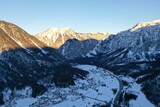 Winter drone shots of the Alps mountains in Austria and Switzerland with lakes 