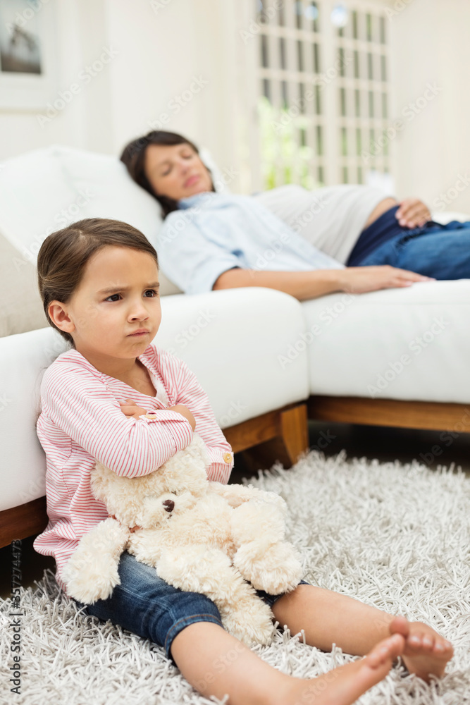 Angry girl watching television with mother Angry girl watching television with mother