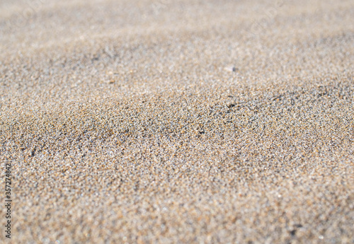 Sand texture and background.Sand on the beach in the background.Sandy beach for black background.Sand of a beach in summer.Copy space.Summer concept