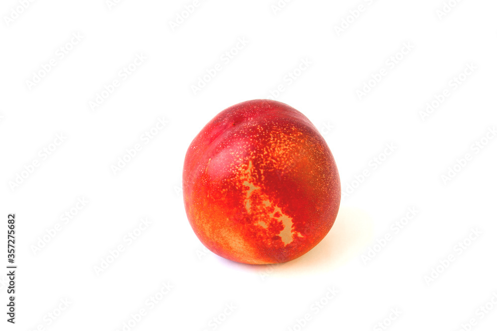 Fototapeta premium One little peach on a white background. Ripe peach, red with yellow spots, fruite and good health food for snack
