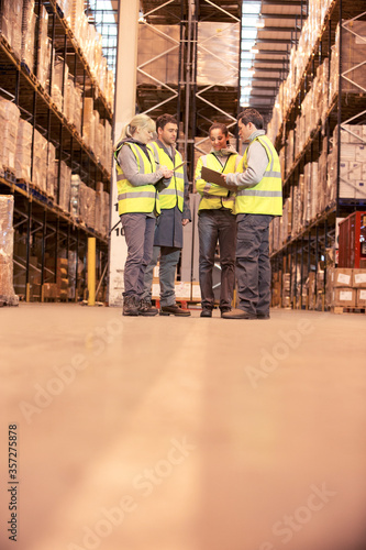 Workers talking in warehouse © Paul Bradbury/KOTO