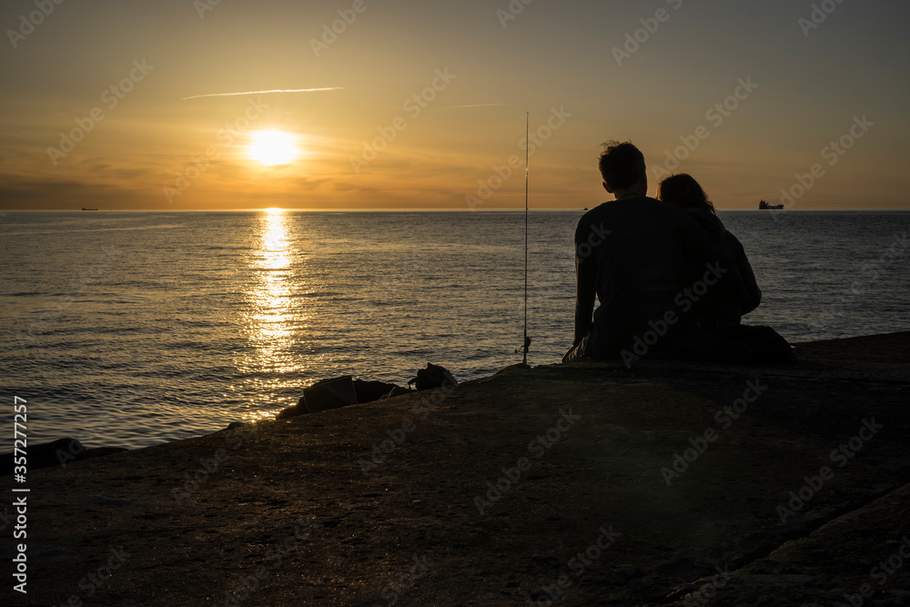 silhouette of a couple at sunset on the beach