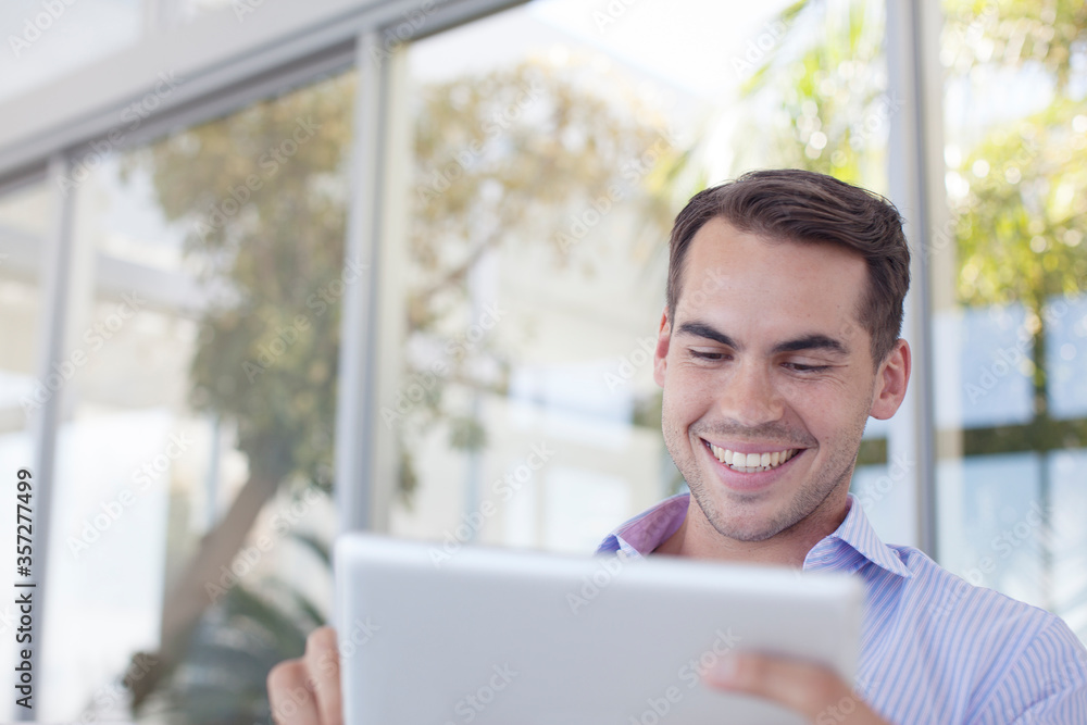Businessman using tablet computer outdoors Businessman using tablet computer outdoors