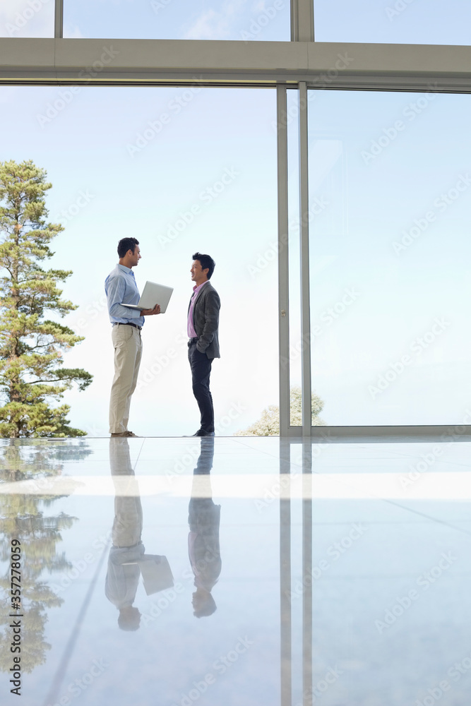 Businessmen talking in office Businessmen talking in office