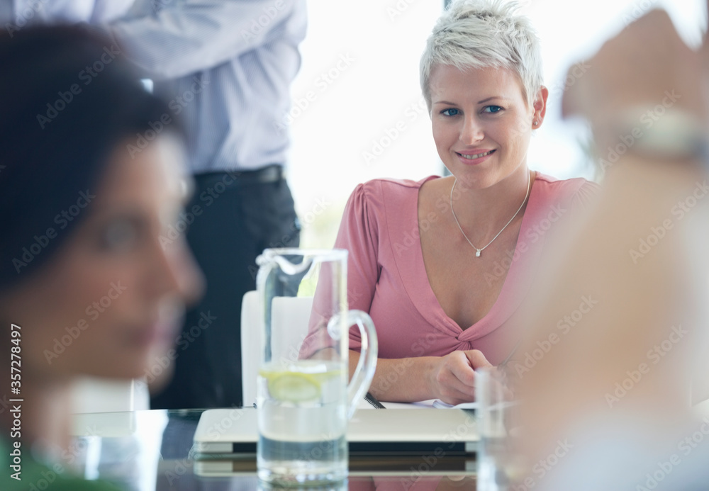 Businesswoman smiling in meeting Businesswoman smiling in meeting