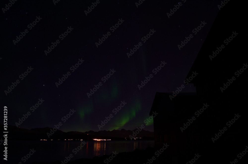 majestic strong aurora borealis on autumn star filled night sky