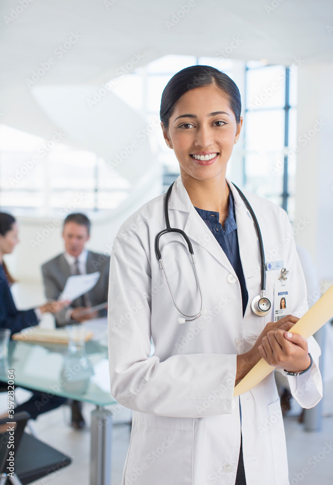 Portrait of smiling doctor in meeting Portrait of smiling doctor in meeting
