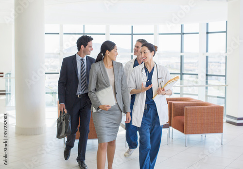 Doctors and business people talking