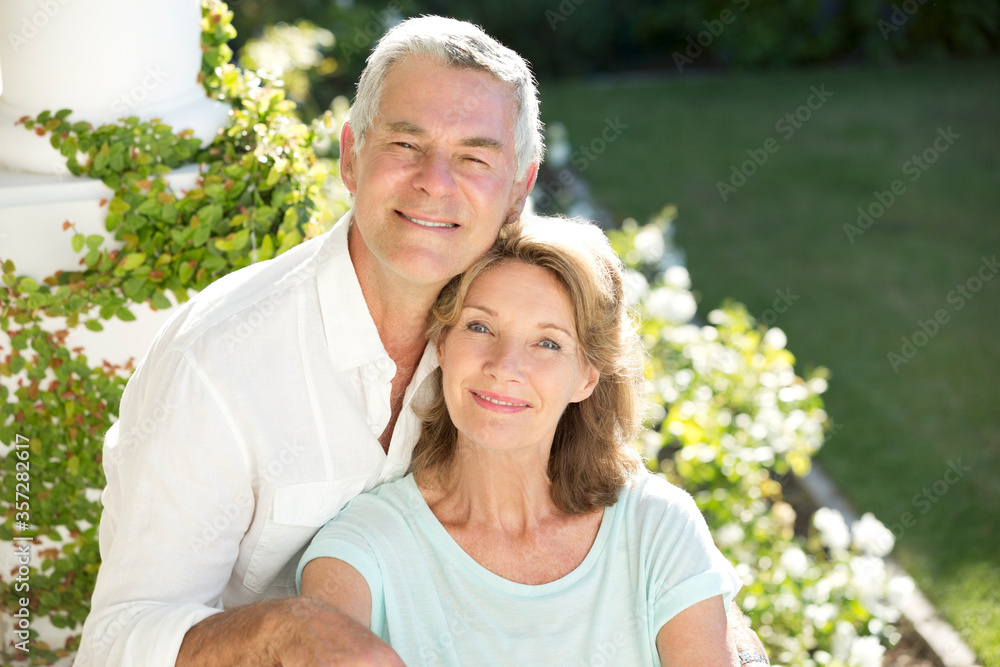 Portrait of smiling senior couple in garden