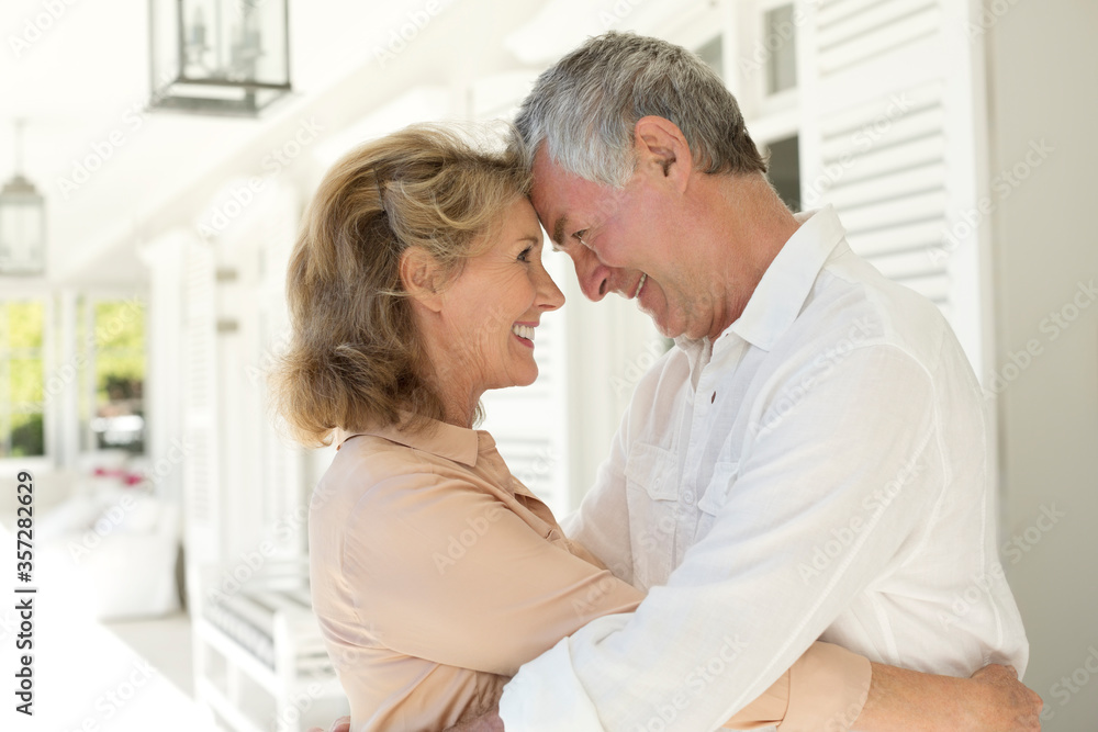 Fototapeta premium Senior couple hugging on patio