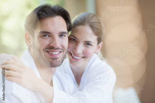 Portrait of smiling couple in bathrobes © Tom Merton/KOTO
