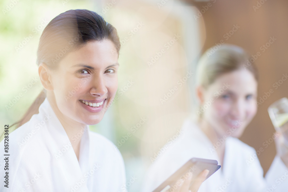 Woman using digital tablet at spa Woman using digital tablet at spa