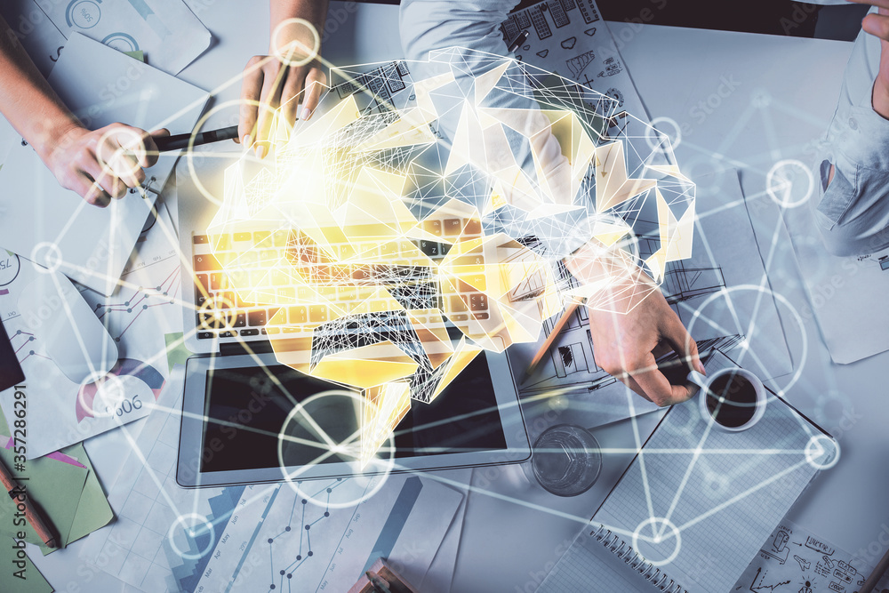 Double exposure of man and woman working together and brain drawing hologram. Intellectual brainstorming concept. Computer background. Double exposure of man and woman working together and brain drawing hologram. Intellectual brainstorming concept. Computer background.