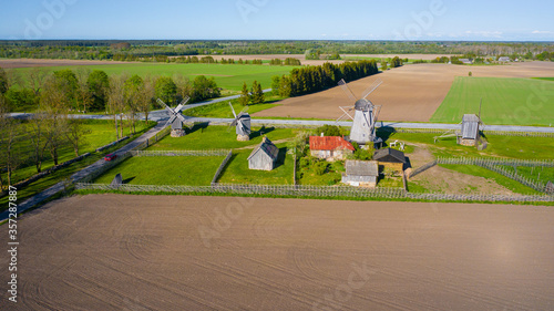 Beautiful panoramic aerial view photo from flying drone to summer fields and Angla windmills in Leisi Parish. Saarema Island, Estonia. (series) photo