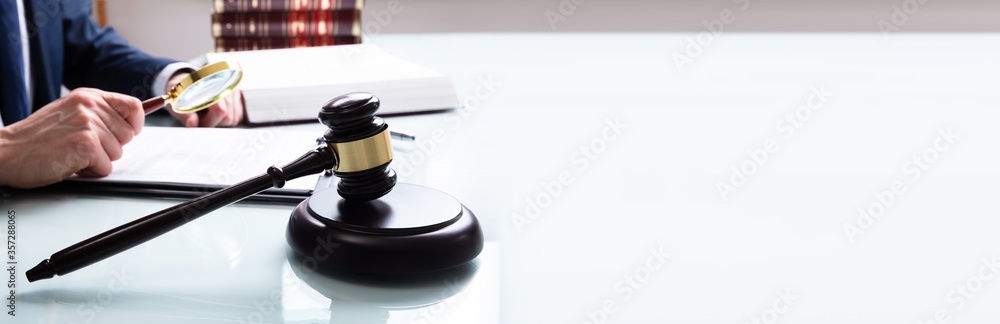 Justice Working On Legal Document In Courtroom Justice Working On Legal Document In Courtroom