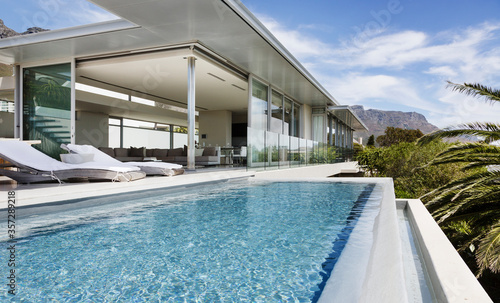 Swimming pool and patio of modern house © Astronaut Images/KOTO