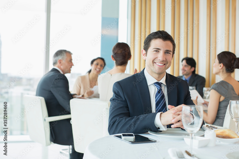 Businessman smiling in restaurant Businessman smiling in restaurant