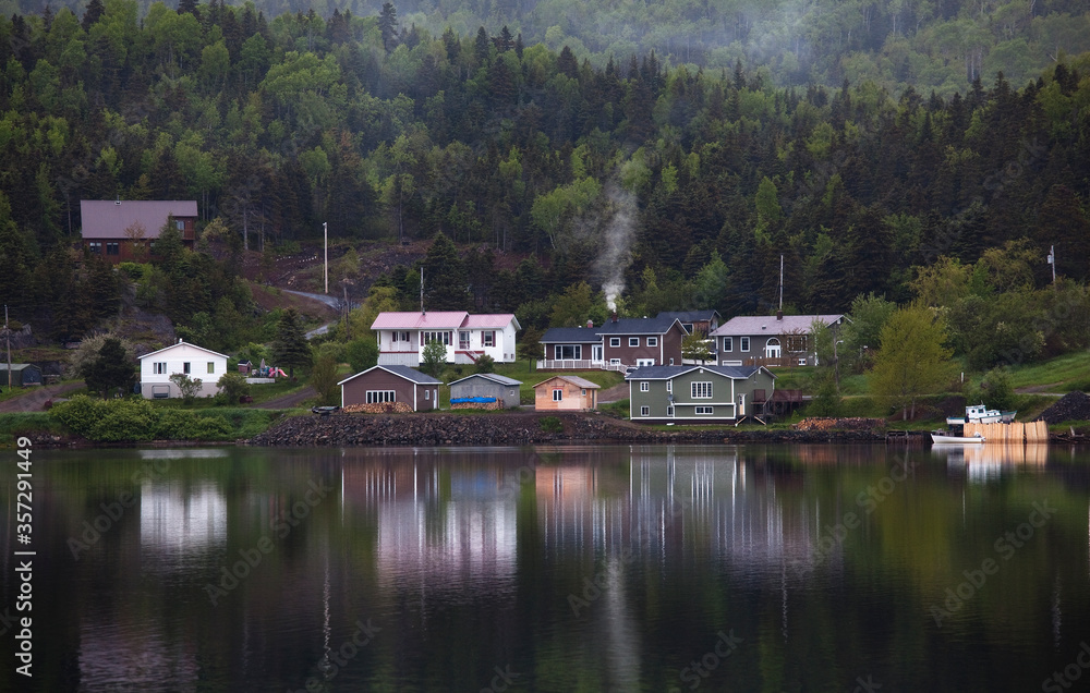Houses along calm bay Houses along calm bay
