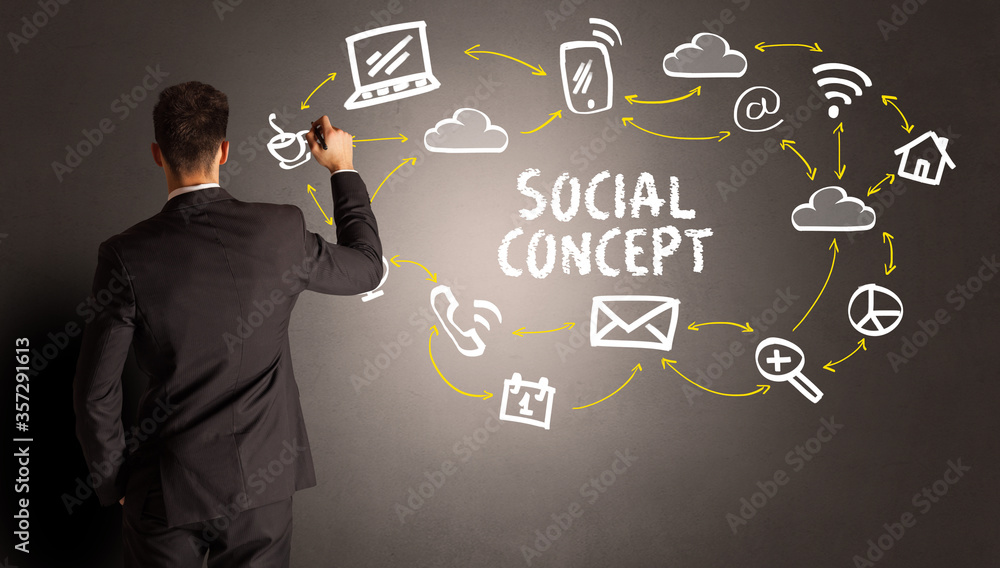 businessman drawing social media icons with SOCIAL CONCEPT inscription, new media concept businessman drawing social media icons with SOCIAL CONCEPT inscription, new media concept